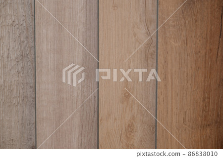Laminate background. Samples of laminate or parquet with a pattern and wood texture for flooring and interior design. Production of wooden floors 86838010