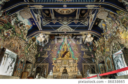 Elaborate sculptures and The buddha image inside the Buddhist church at the famous of The Pariwas temple. Elaborate sculptures and The buddha image inside the Buddhist church at the famous of The Pariwas temple. 86838665
