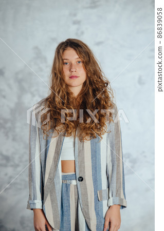 Pretty female looking at camera. Studio shot of beautiful woman. Pretty female looking at camera. Studio shot of beautiful woman. 86839058