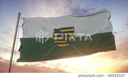 Saxony flag, Germany, waving in the wind, sky and sun background. 3d rendering 86839387