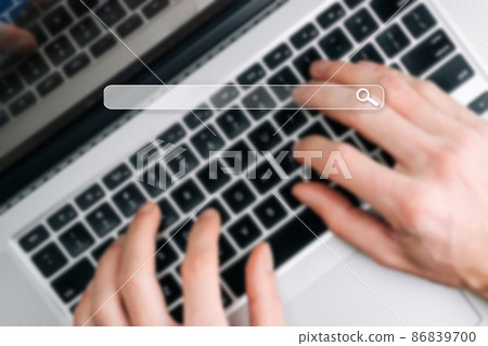 Searching internet. Online website search engine selective focus. Blured hands using computer for searching browsing internet data information networking concept. 86839700