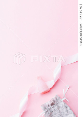 Menstrual cycle sanitary cup. Pink ribbon with menstrual cup. Menstruation feminine period. Sanitary hygiene banner. Use menstrual cup inside vagina. Menstrual cycle sanitary cup. Pink ribbon with menstrual cup. Menstruation feminine period. Sanitary hygiene banner. Use menstrual cup inside vagina. 86839701