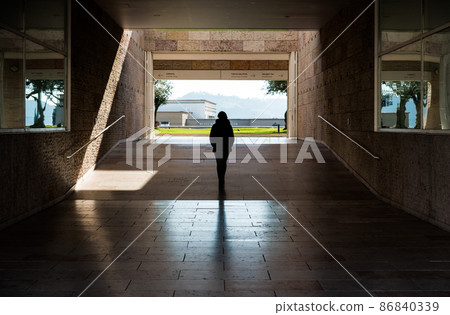 Belem, Lisbon / Portugal -  Young white woman  walking through the museum of contemporary art 86840339