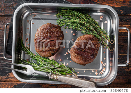 BBQ Grilled Tenderloin meat steaks, Fillet Mignon. Wooden background. Top view 86840478