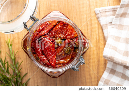 Sun dried tomatoe. Pickled tomatoes in jar. Sun dried tomatoe. Pickled tomatoes in jar. 86840809
