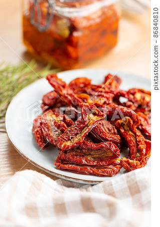 Sun dried tomatoes on plate. Sun dried tomatoes on plate. 86840810