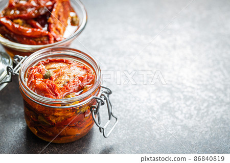Sun dried tomatoe. Pickled tomatoes jar. Sun dried tomatoe. Pickled tomatoes jar. 86840819