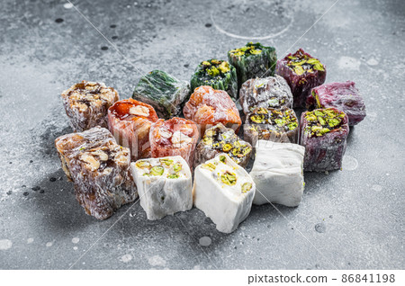 Set of Arabic Lukum, a national Turkish dessert. Gray background. Top view 86841198