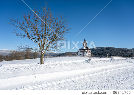 Wooden evangelic chapel in Tesarov in wintertime 86841763