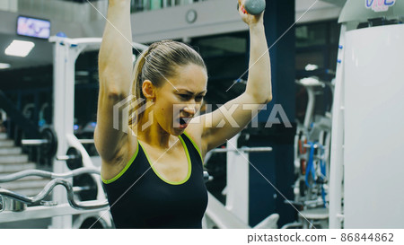 Fit Athletic Woman Exercises with Dumbbell. Bodypositive Girl with Beautiful Hairy Armpits. Sweat smell. Fit Athletic Woman Exercises with Dumbbell. Bodypositive Girl with Beautiful Hairy Armpits. Sweat smell. 86844862