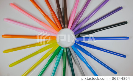 Many colored pencils are arranged around the edges of the image Many colored pencils are arranged around the edges of the image 86844864