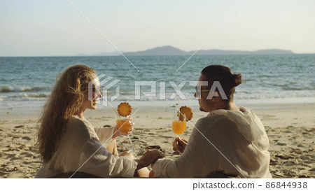 Loving couple in white dress, sunglasses, relax and drinking coc 86844938