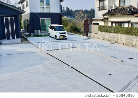 Parking lot in front of a slightly old house Parking lot in front of a slightly old house 86846086
