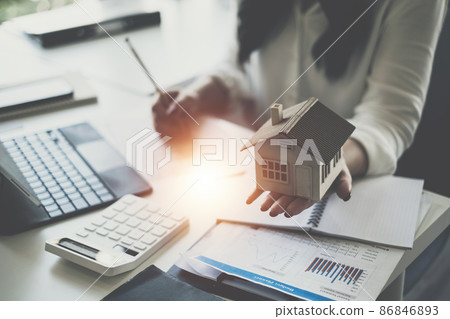 A woman holding and checking house model .Real Estate House Appraisal And Inspection and Insurance concept. 86846893