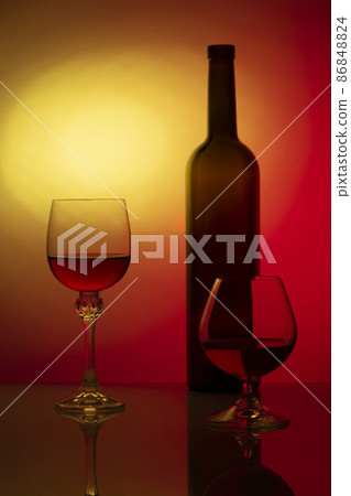 Still life with glass bottle and wine glasses Still life with glass bottle and wine glasses 86848824