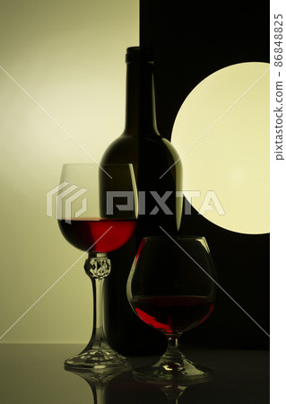 Still life with glass bottle and wine glasses Still life with glass bottle and wine glasses 86848825