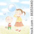 Girls and boys playing with soap bubbles 86850440