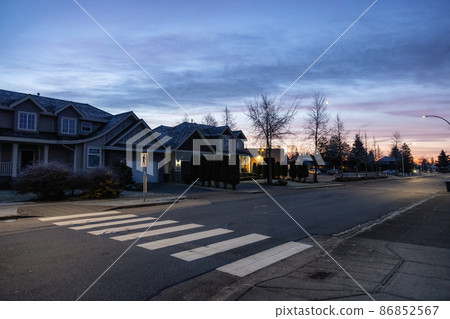 View of Residential Suburban Neighborhood Street in a modern city View of Residential Suburban Neighborhood Street in a modern city 86852567