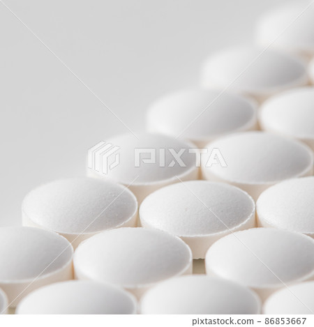 Rows of pills on a white background. Health care, medicine, pharmacy and disease concept Rows of pills on a white background. Health care, medicine, pharmacy and disease concept 86853667