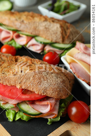 Concept of tasty eating with ciabatta sandwiches, close up 86854161