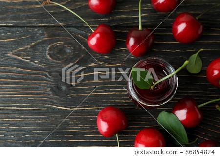 Cherry jam and ingredients on rustic wooden table 86854824
