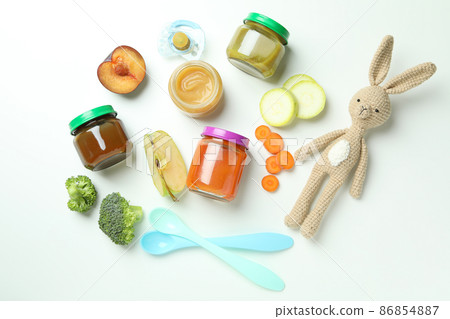 Concept of baby food on white background Concept of baby food on white background 86854887