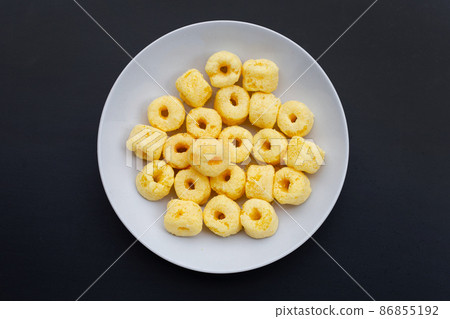 Roller corn snack on dark background 86855192