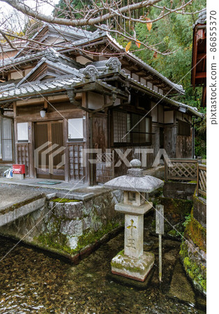 A clear stream of the Jizo River in Samegai, Maibara City, Shiga Prefecture, a landscape with famous water called Juo-sui and stone lanterns. A clear stream of the Jizo River in Samegai, Maibara City, Shiga Prefecture, a landscape with famous water called Juo-sui and stone lanterns. 86855370