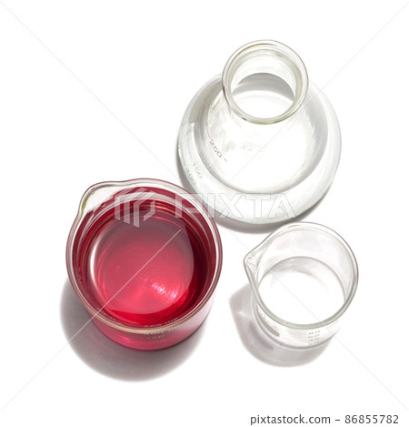 Chemicals ingredient on white laboratory table. Potassium Permanganate Liquid in beaker and Alcohol in Erlenmeyer flask. Chemicals ingredient on white laboratory table. Potassium Permanganate Liquid in beaker and Alcohol in Erlenmeyer flask. 86855782