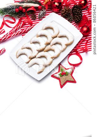 Christmas and New Year symbols and attributes of winter holidays - candy, cookies, pine cone Christmas and New Year symbols and attributes of winter holidays - candy, cookies, pine cone 86856421