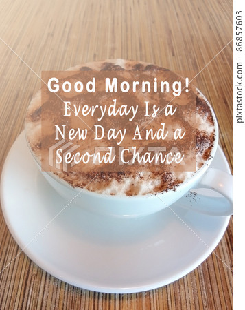 Motivational and inspirational quote on a coffee cup. Motivational and inspirational quote on a coffee cup. 86857603