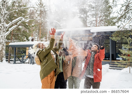 Friends having fun during winter vacations Friends having fun during winter vacations 86857604