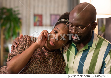 African young couple watching drama movie at home African young couple watching drama movie at home 86857863