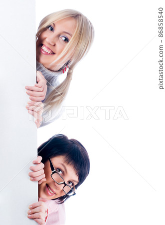 Two pretty woman beside whiteboard 86858540