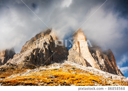 Incredible view of the Three Peaks of Lavaredo in morning fog 86858568