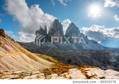 Incredible view of the Three Peaks of Lavaredo on autumn time Incredible view of the Three Peaks of Lavaredo on autumn time 86858576