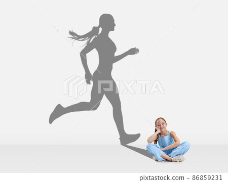 Little girl, child dreaming about future of professional athlete 86859231