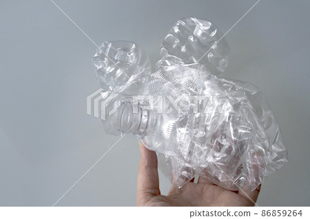 A crushed PET bottle for recycling in your hand 86859264