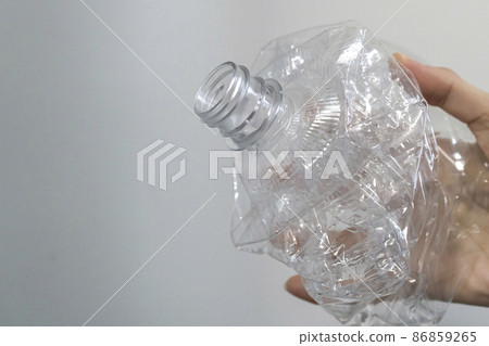 A crushed PET bottle for recycling in your hand 86859265