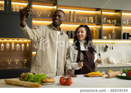 Couple bloggers record process of cooking salad on camera 86859584