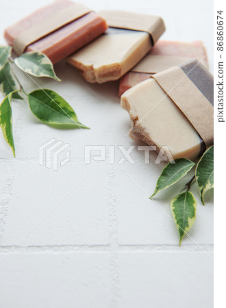 Handmade soap bars and green leaves 86860674