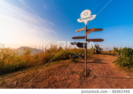 blank direction sign with pin location on pole on peak top of mountain in nature with beautiful sunrise or sunset for tourist who trek to this route 86862498