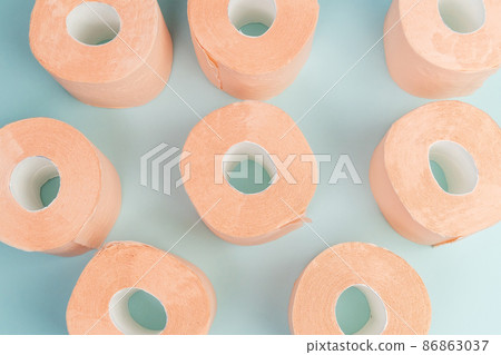 Toilet paper orange color top view. Hygiene concept. Toilet paper orange color top view. Hygiene concept. 86863037