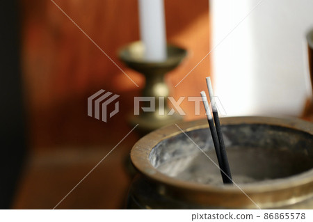 Incense sticks and a brass incense holder Incense sticks and a brass incense holder 86865578