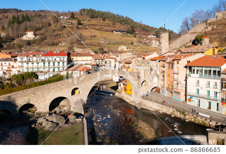 View from drone of Camprodon townscape onTer river surrounded by Pyrenees View from drone of Camprodon townscape onTer river surrounded by Pyrenees 86866685
