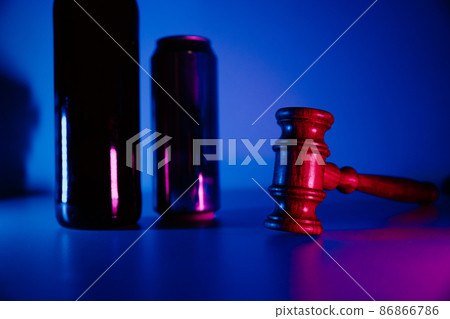 Bottle with whisky, jar of beer and judge gavel, alcohol and crimes concept Bottle with whisky, jar of beer and judge gavel, alcohol and crimes concept 86866786