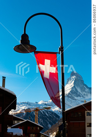 Swiss flag and Matterhorn mountain 86866937