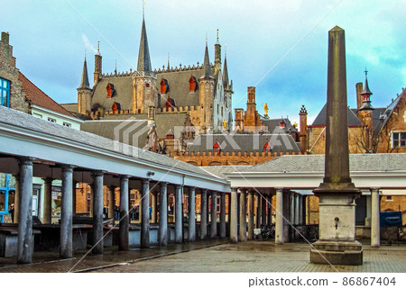Old Fish Market called Vismarkt and medieval historical buildings of Bruges Belgium 86867404