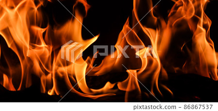 Flames of fire on a black background. The mystery of fire. Flames of fire on a black background. The mystery of fire. 86867537