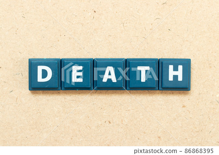 Tile alphabet letter in word death on wood background 86868395
